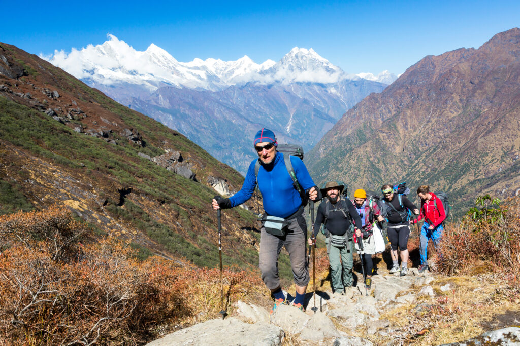 Group of Mountain Climbers walking up on Mountain Trail